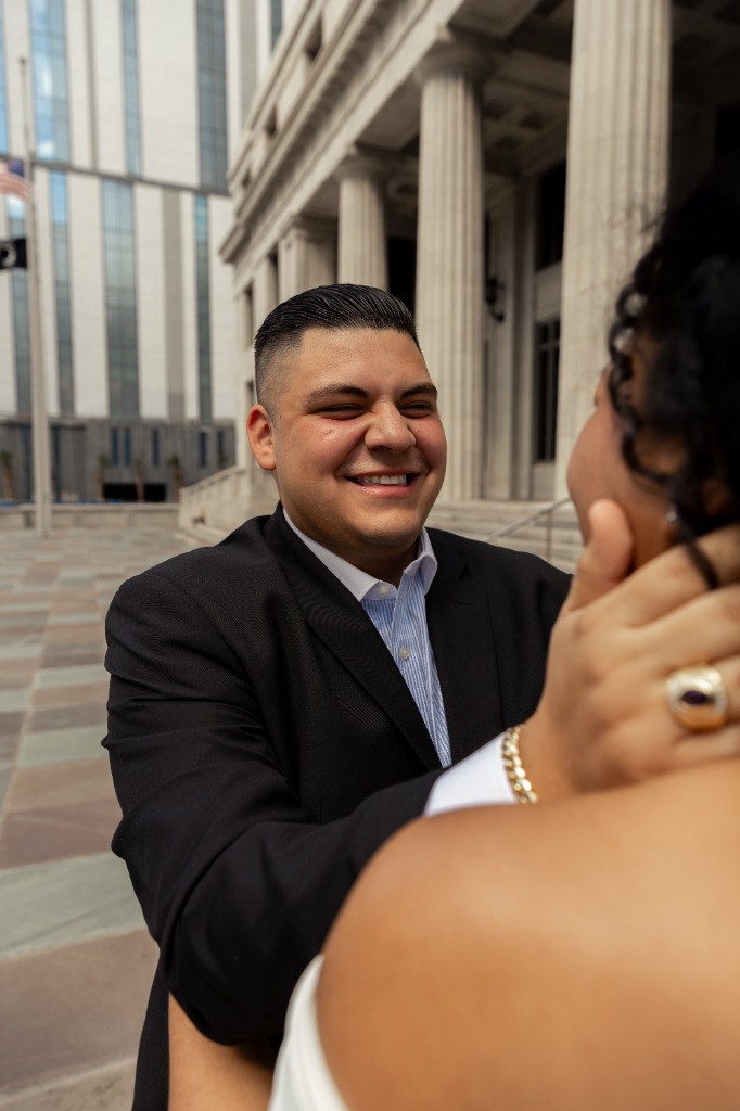 Close-up of couple, man smiling and looking lovingly at woman